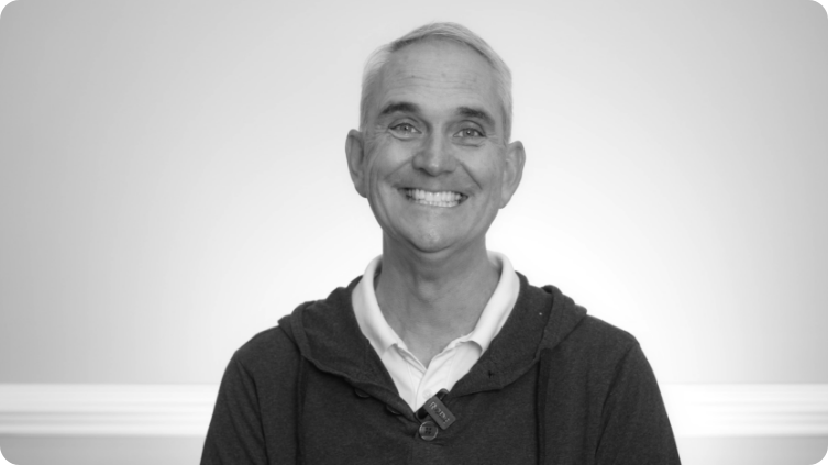 Smiling man in a dark jacket